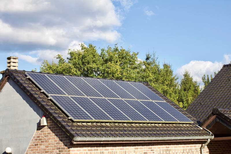 High Angle Shot of PV Solar Panels on the Roof of a Building Stock