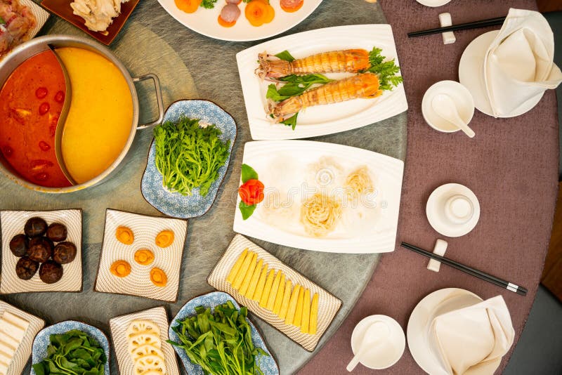 High angle shot of a side dishes around a soup on an oriental table stock image High angle shot of a side dishes around a soup on an oriental table stock image