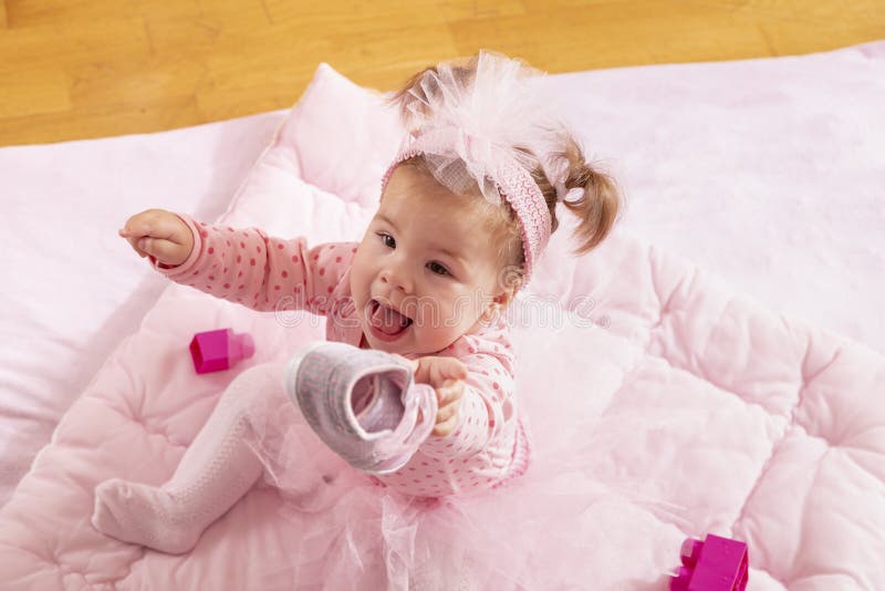 Baby Girl Playing with Her Shoes Stock Photo - Image of funny, people ...