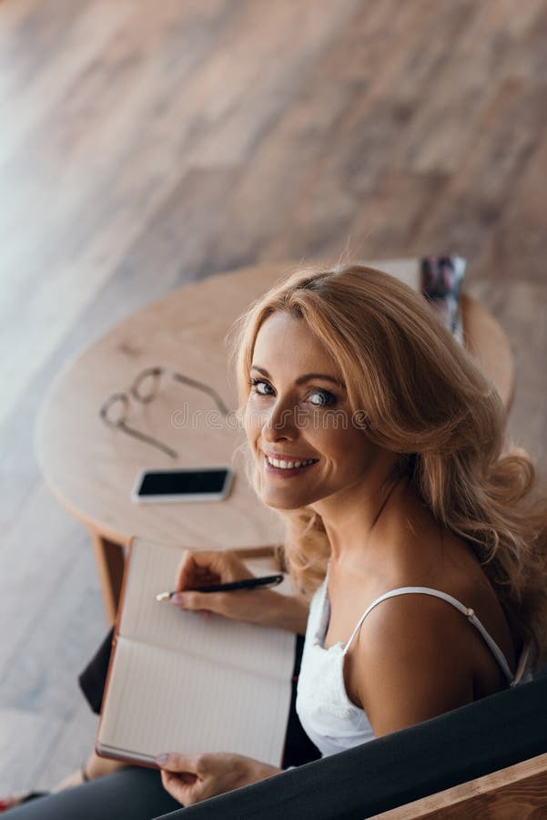 high angle view of beautiful middle aged woman