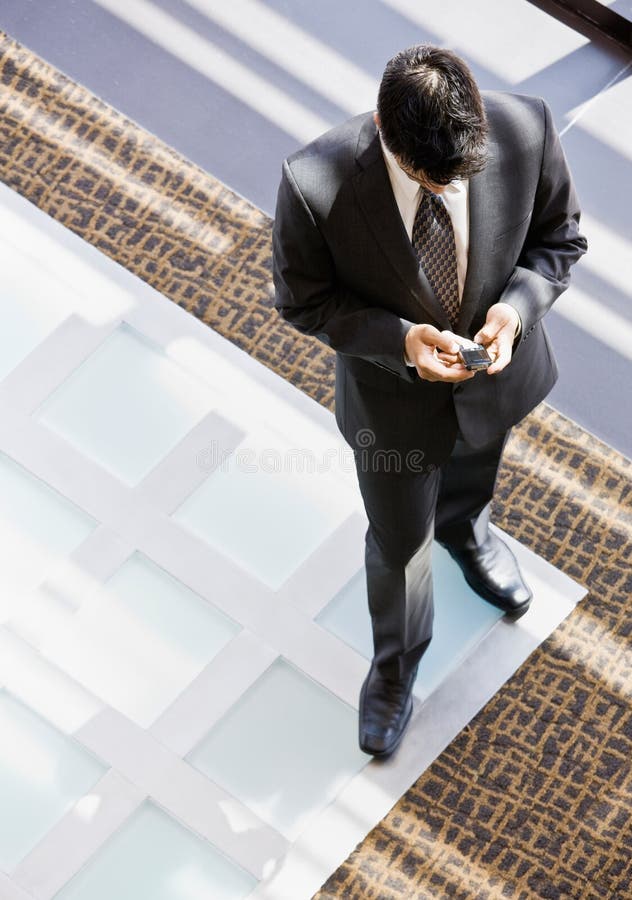 High angle view of businessman with cell phone royalty free stock photo