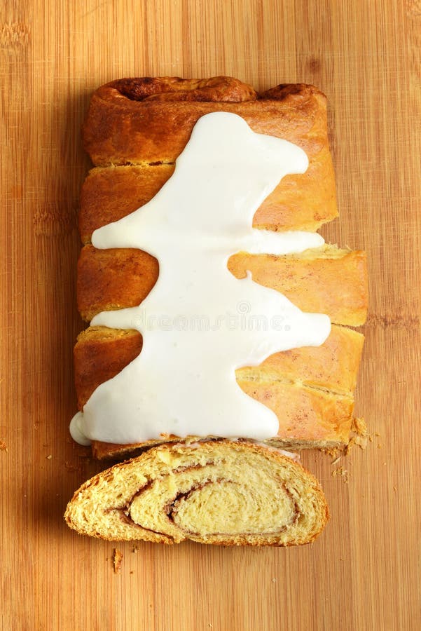 High angle view cinnamon roll loaf cake with icing sugar royalty free stock images