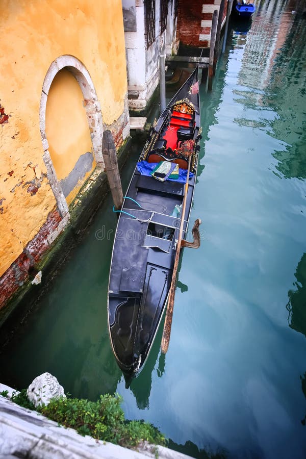 Gondola With The High Bell Tower Of The Saint Marco In