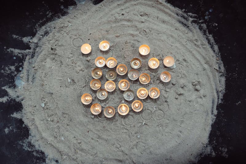 High angle view of illuminated candles on floor stock images