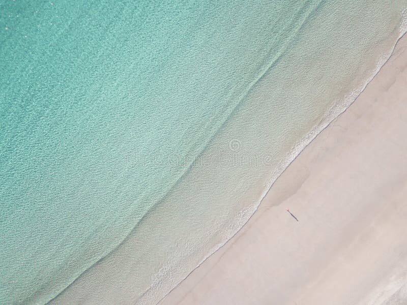 High angle view of lonely man on the beach stock images