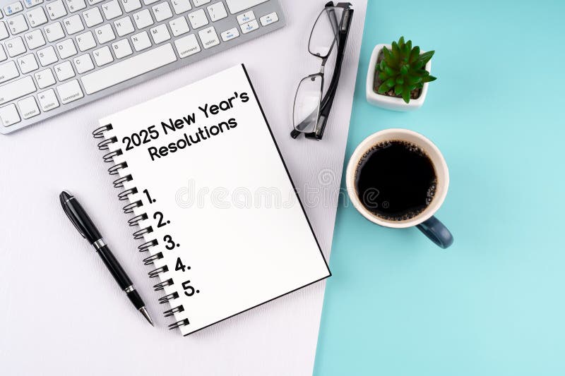 High angle view of 2025 New Year\'s Resolutions text on notepad stock photos