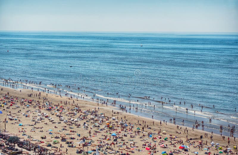 High angle view of people at beach against sky stock photo