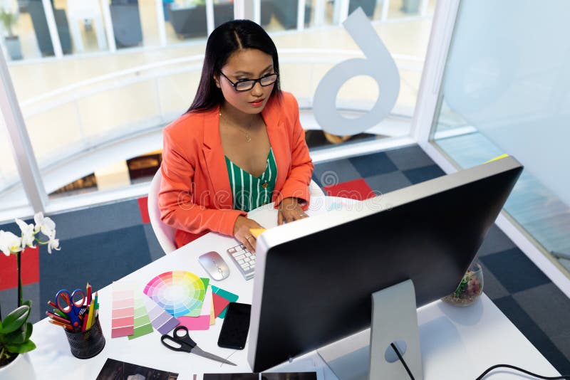 Female graphic designer working on computer