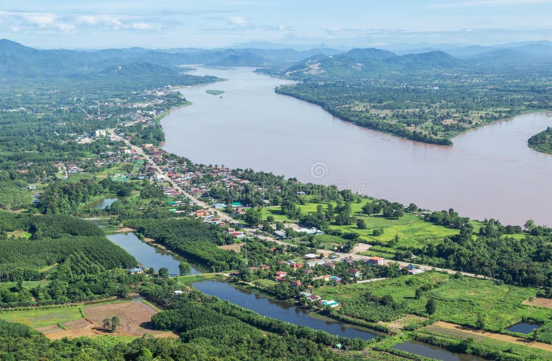 High angle view of Sangkhom district from viewpoint skywalk at Wat Pha Tak Suea , Nong Khai province ,Thailand with Mekong river between border thai - Laos People`s Democratic Republic