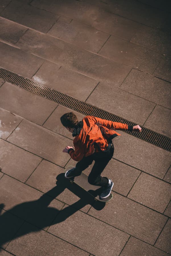 High Angle View of Skateboarder in Red Jacket Preparing Stock Photo ...