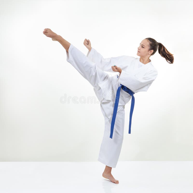 A High Circular Kick Kicks the Athlete in Karategi Stock Photo Image