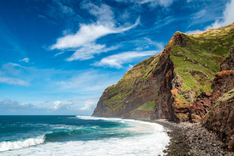 High coast mountains with large waves, Calhau das Achadas, Madeira island, Portugal