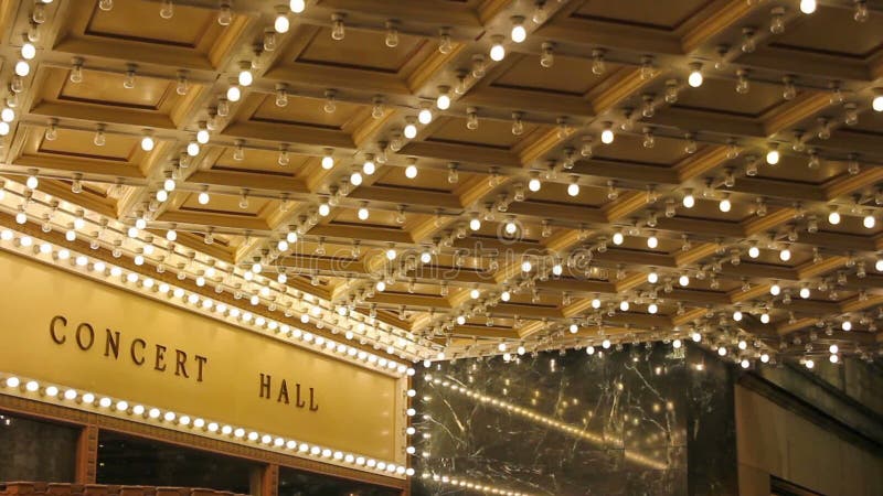 High definition of blinking concert hall ceiling lights on broadway along a entertainment street 1080p