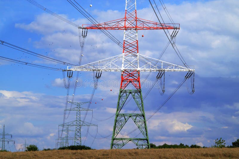 High electricity pylons in the pasture