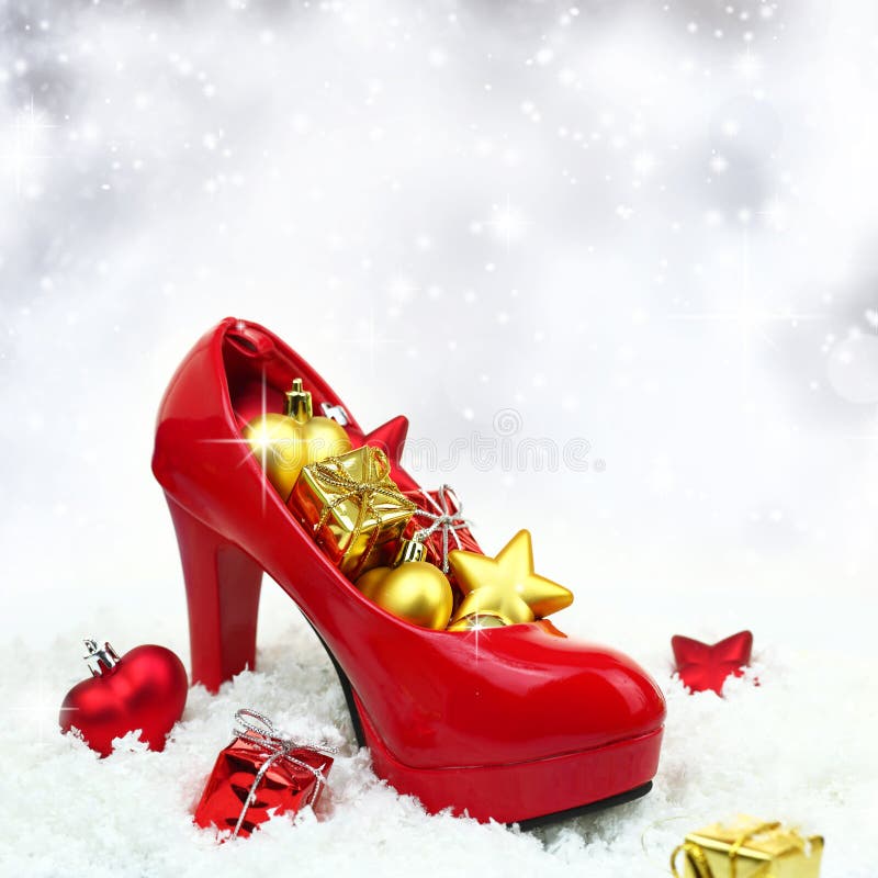 Christmas decoration with hippie icon figurine and female high heel shoes  hanging on a Christmas tree. Creative decor Stock Photo - Alamy