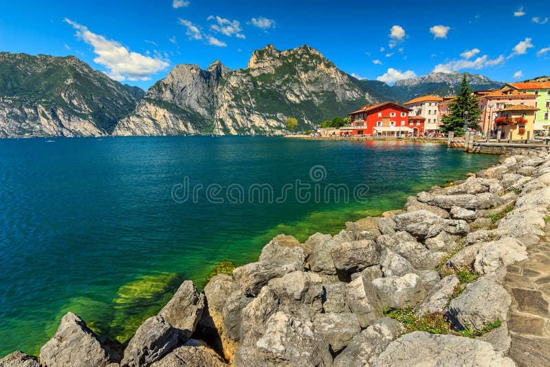 High mountains,lake and city,Lake Garda,Torbole,Italy,Europe. The beautiful Lake Garda and Torbole resort town,Italy,Europe royalty free stock photos High mountains,lake and city,Lake Garda,Torbole,Italy,Europe. The beautiful Lake Garda and Torbole resort town,Italy,Europe royalty free stock photos