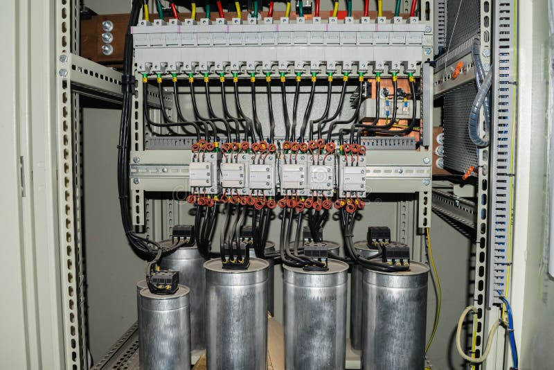 High-power capacitors installed in the electric box. Powerful electrical switches. royalty free stock photos