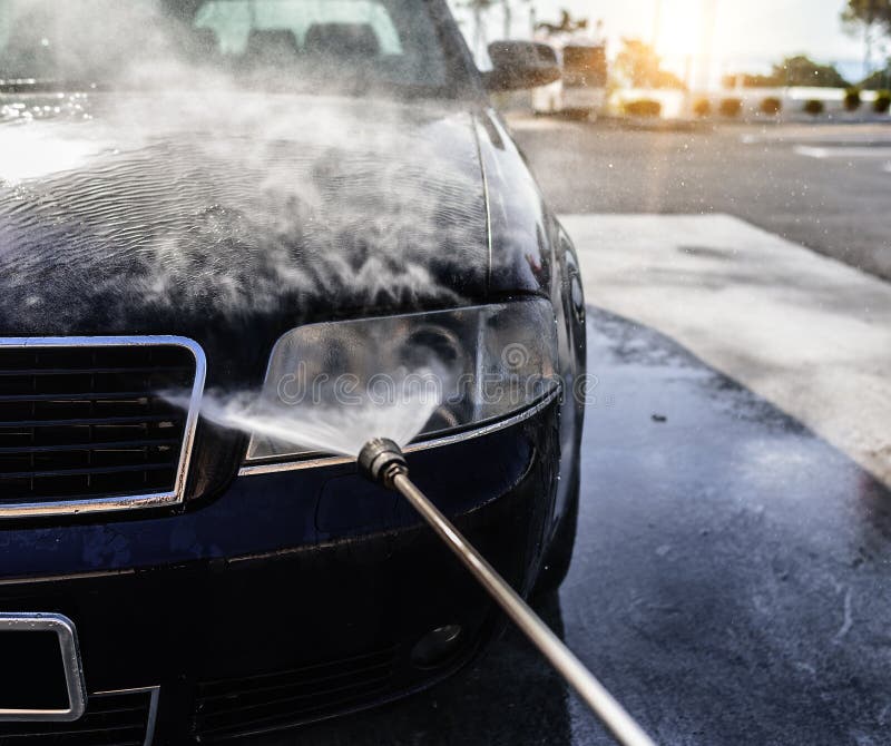 Highpressure Washing Car. Car Washing Under the Open Sky. Stock Photo