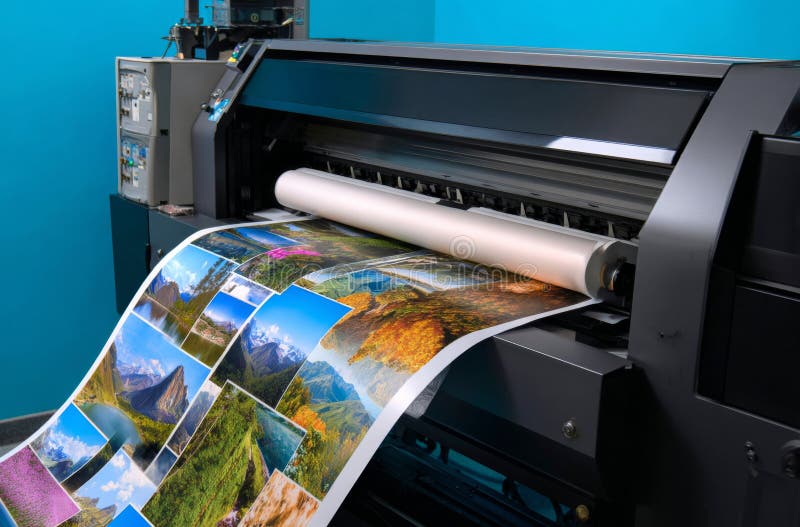 High-Quality Large Format Printer Creating Vibrant Photo Prints for Professional Use in a Brightly Colored Studio Environment royalty free stock images