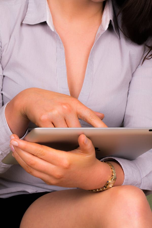 Beautiful young female using an ipad tablet device