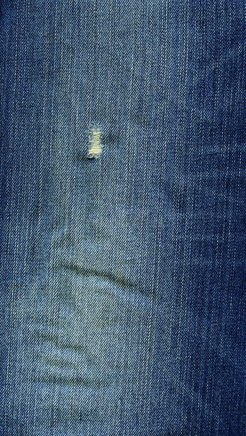 Denim Fabric Texture - Damaged Blue royalty free stock photo