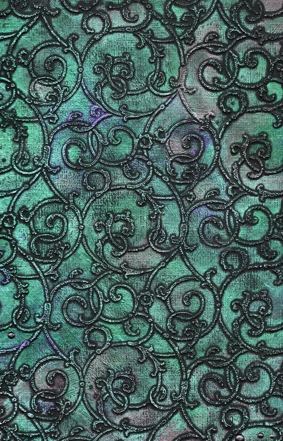 The high-resolution texture of plaster arabesque pattern covered with green metallic color. The high-resolution texture of plaster arabesque pattern covered with green metallic color