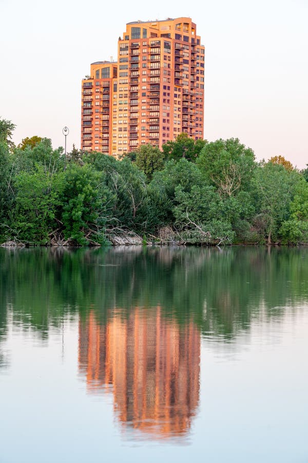 High Rise Apartment on the Edge of a Lake Reflection Stock Image