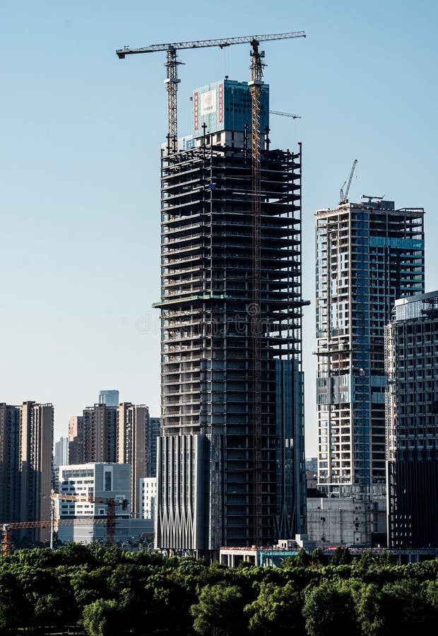 High-rise building under construction in urban cityscape royalty free stock images