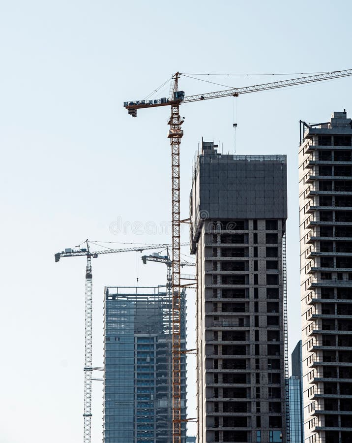 High-rise buildings under construction with cranes. royalty free stock photo