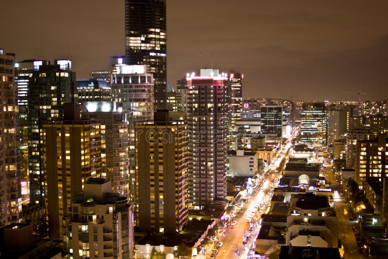 High rise city at night stock photography