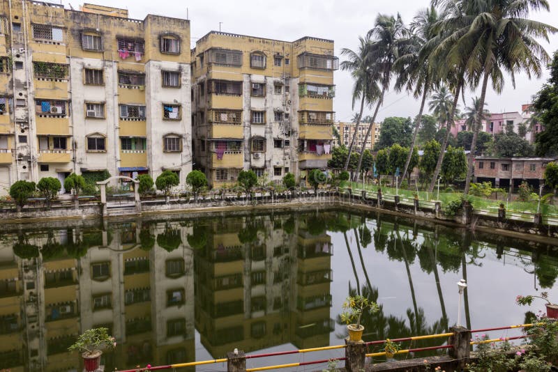 A High Rise Residential Apartment with a Big Pond Stock Photo Image
