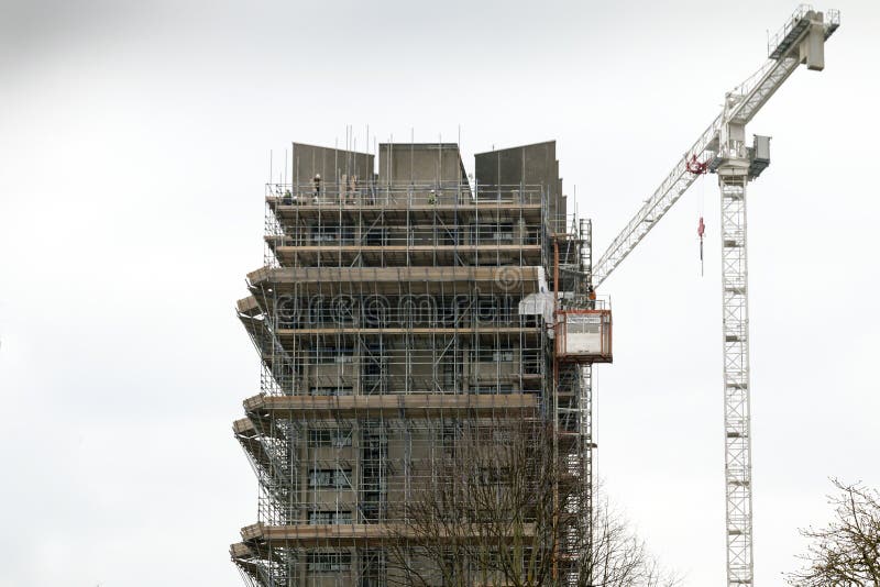Coventry, West Midlands, UK - April 7, 2018: High rise Priory halls student residents surrounded with scaffolding ready for demolition in Coventry city centre. Coventry, West Midlands, UK - April 7, 2018: High rise Priory halls student residents surrounded with scaffolding ready for demolition in Coventry city centre