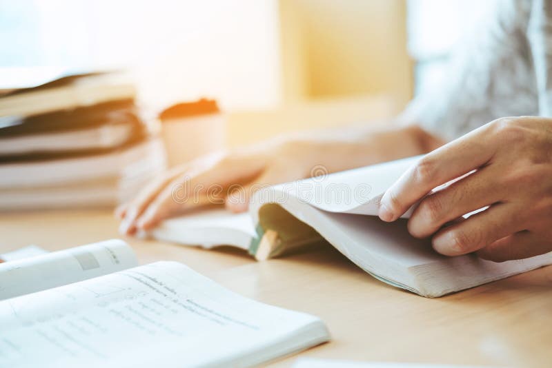 High school or college students studying and reading in library royalty free stock photo