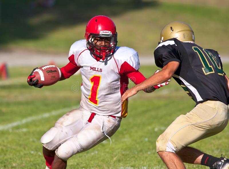 High School Football Player Running with the Ball