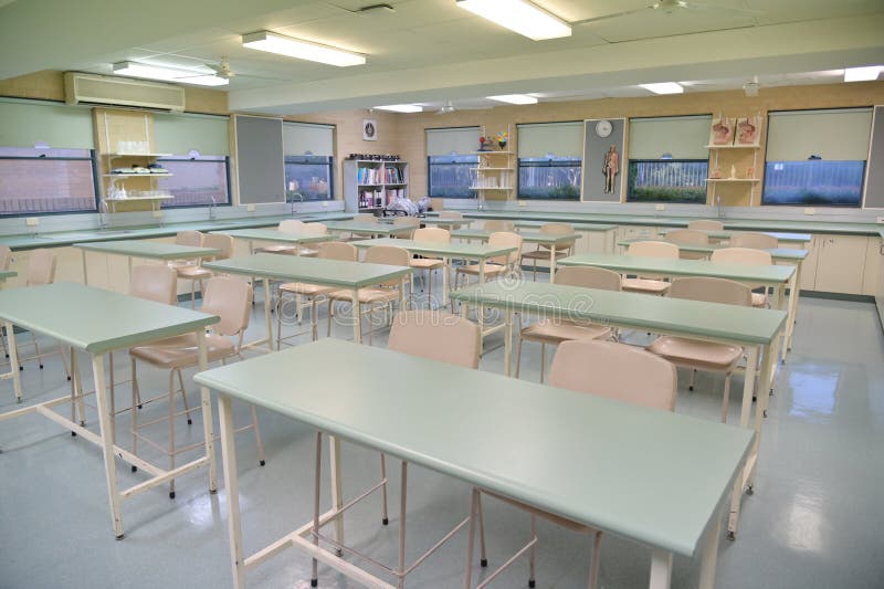 An empty high school science lab classroom with no students