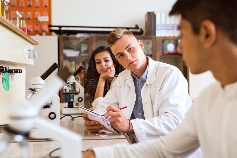 High School Student with Microscopes in Laboratory. Stock Image Image