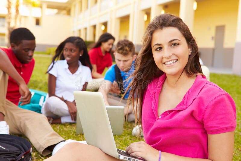 High School Students Studying Outdoors On Campus