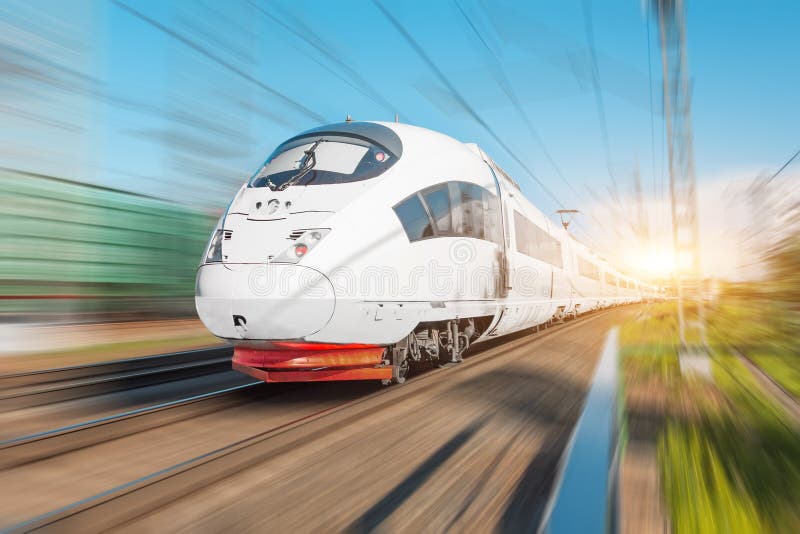 High speed electric train passenger rides at high speed at the railway station in the city.