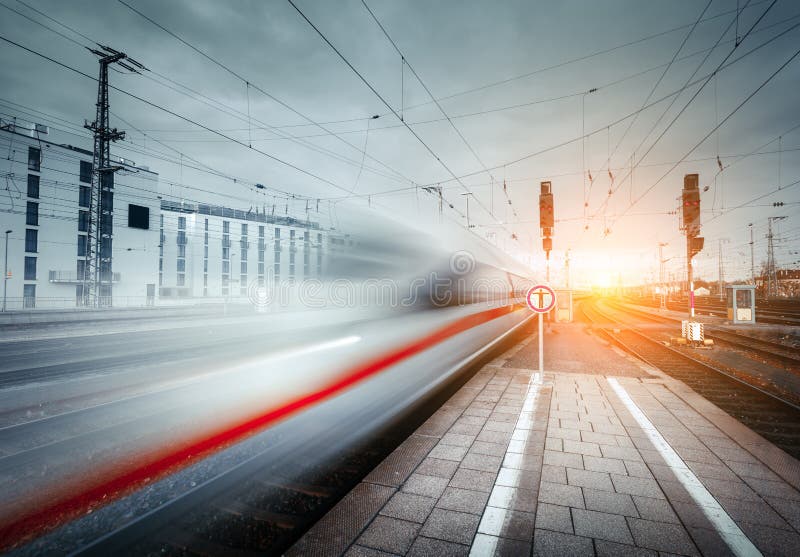 High speed passenger train on railroad track in motion