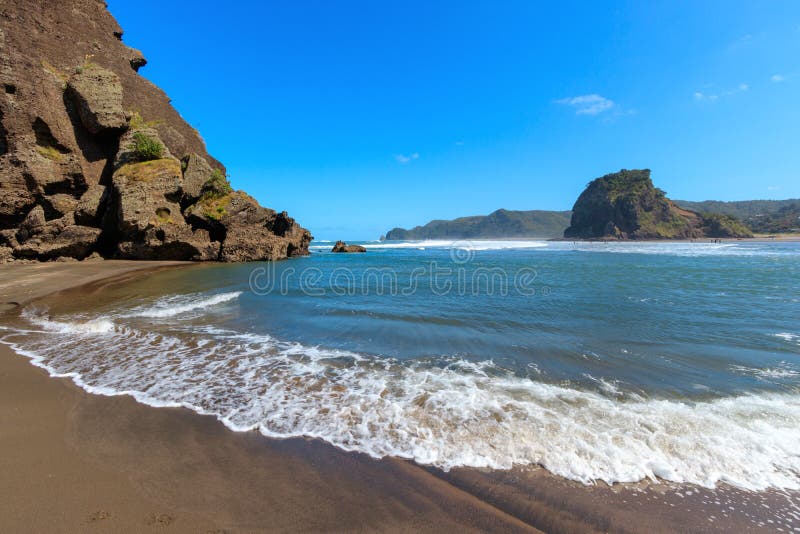 High tide Lion Rock at Piha beach, Lion Rock, New Zealand stock image High tide Lion Rock at Piha beach, Lion Rock, New Zealand stock image
