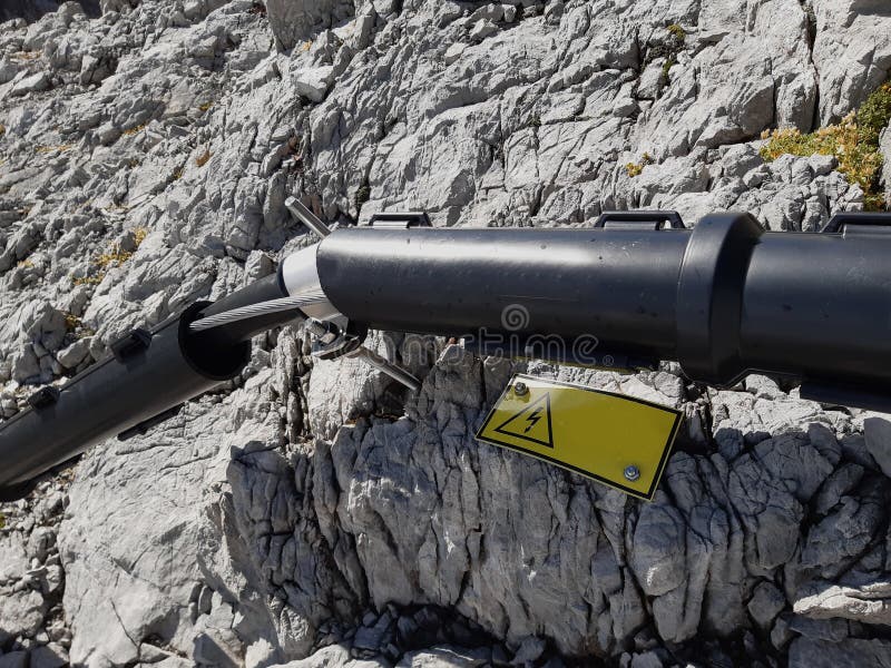 The High Voltage Cable is Attached To the Limestone Rock Using Stock