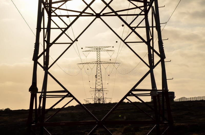 High Voltage Electric Transmission Tower. Pollution, environment.