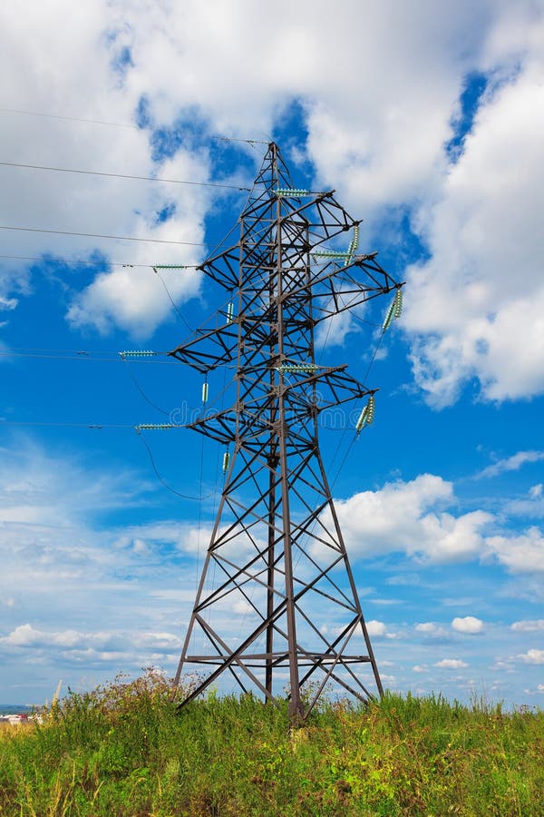 High voltage lines beneath the blue cloudy sky. High voltage lines beneath the blue cloudy sky