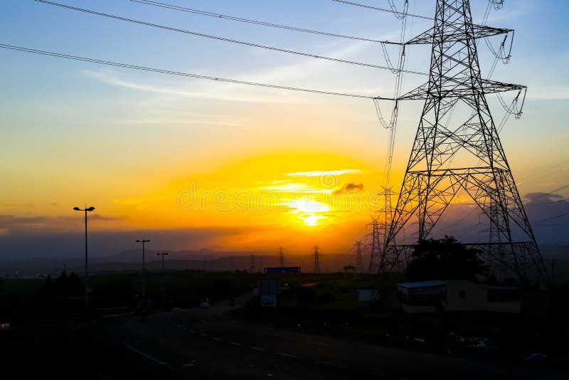 High-voltage power lines at sunset,high voltage electric transmission tower