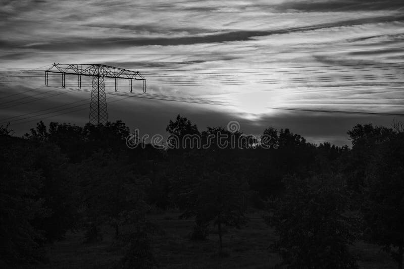 High Voltage Power Pole with Overhead Line through Which Electricity is