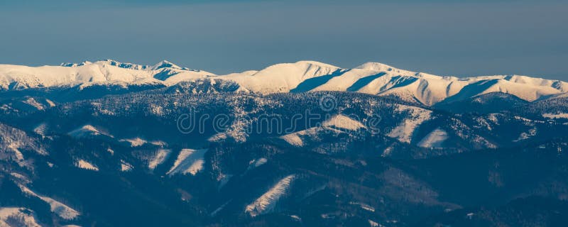 Highest part of Nizke Tatry mountains from Martinske hole in Mala Fatra mountains in Slovakia during winter