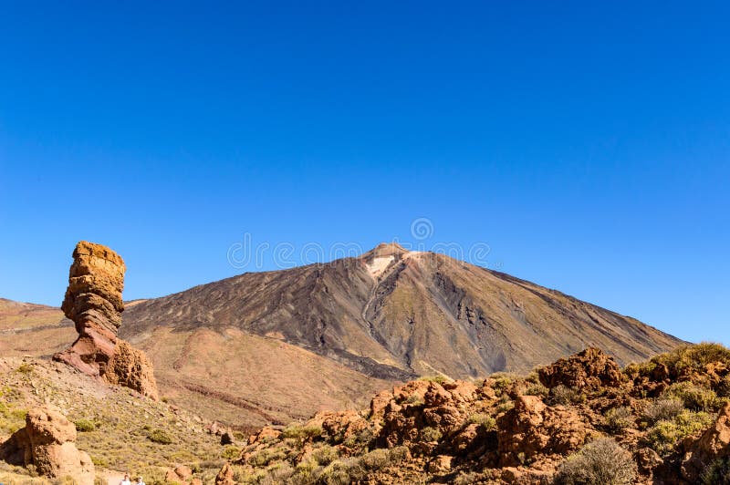 Highest Peak Behind Roque Cinchado On A Sunny And Very Clear Day In El Teide National Park. April 13, 2019. Santa Cruz De Tenerife Spain Africa. Travel Tourism Street Photography