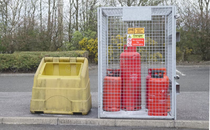 Highly flammable gas propane cylinders store cage for safety near construction building site and the public protection from explos stock photos Highly flammable gas propane cylinders store cage for safety near construction building site and the public protection from explos stock photos
