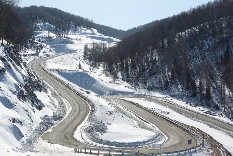 Highway among snow mountain , Belokurikha, Altai, Russia