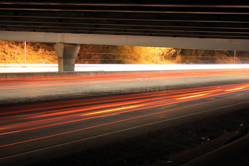 highway traffic under bridge